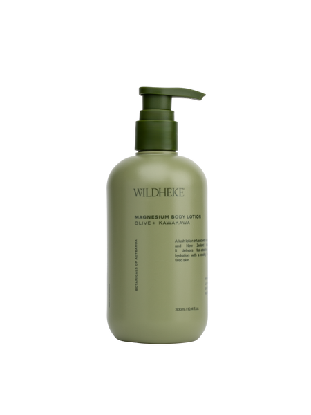 Green bottle of Wildheke magnesium body lotion on a white background